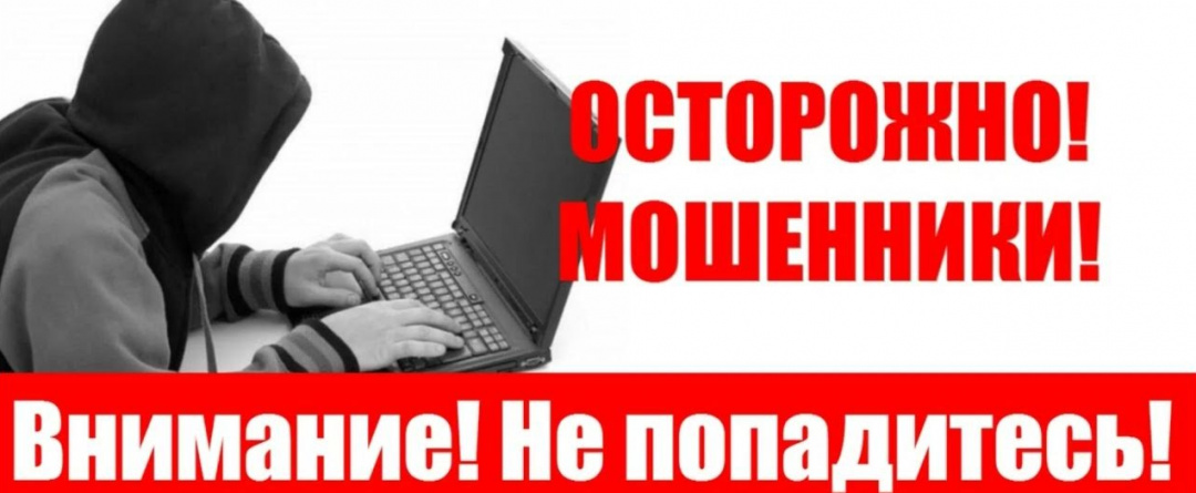 На картинке изображен человек в капюшоне закрывающем лицо сидящий за ноутбуком.